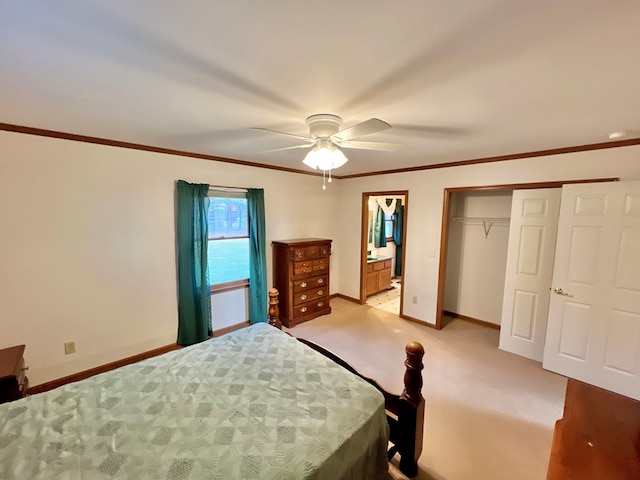 unfurnished bedroom with ensuite bathroom, ornamental molding, light colored carpet, ceiling fan, and a closet