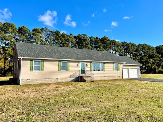 view of front facade featuring a front yard and a garage