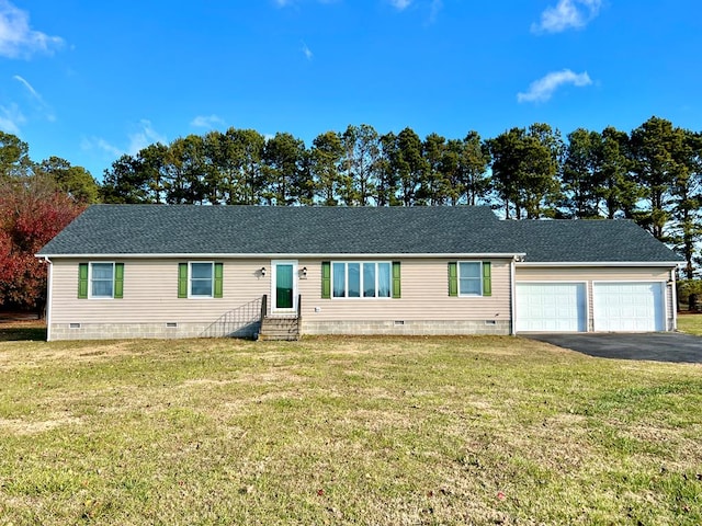 view of front facade featuring a front lawn and a garage