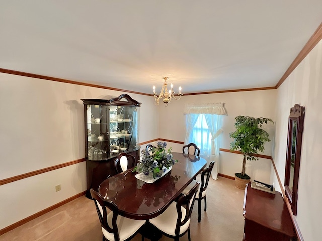 dining area with a chandelier, crown molding, and light colored carpet