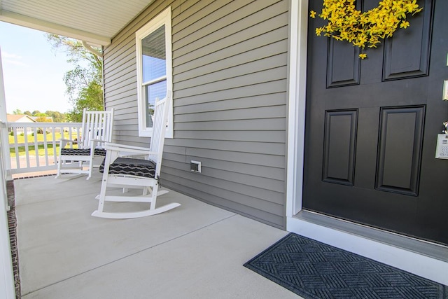 2265 Yardarm Dr, Greenbackville, VA 23356 - doorway to property featuring covered porch