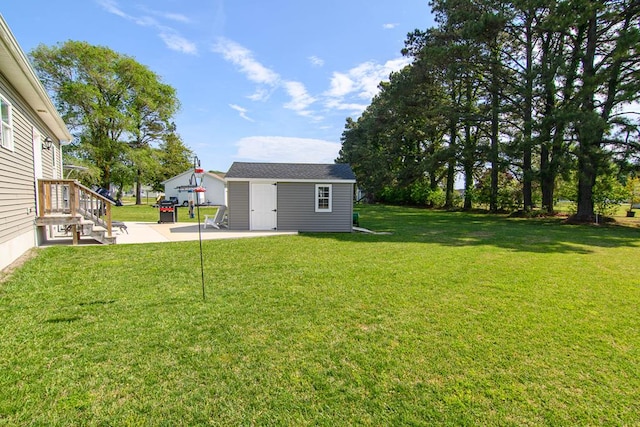 2265 Yardarm Dr, Greenbackville, VA 23356 - view of yard with a patio and an outbuilding