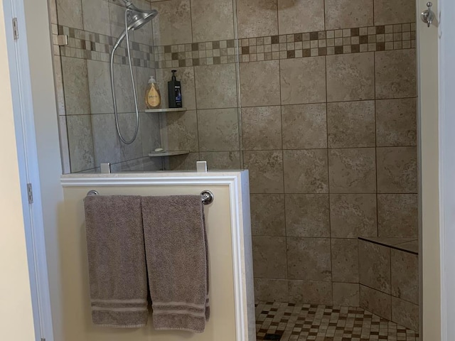 bathroom with tiled shower