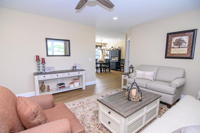 2265 Yardarm Dr, Greenbackville, VA 23356 - living room with recessed lighting, baseboards, wood finished floors, and ceiling fan with notable chandelier