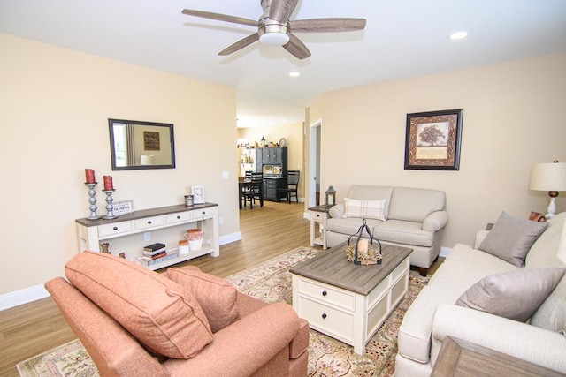 2265 Yardarm Dr, Greenbackville, VA 23356 - living room featuring a ceiling fan, baseboards, recessed lighting, and light wood-style flooring
