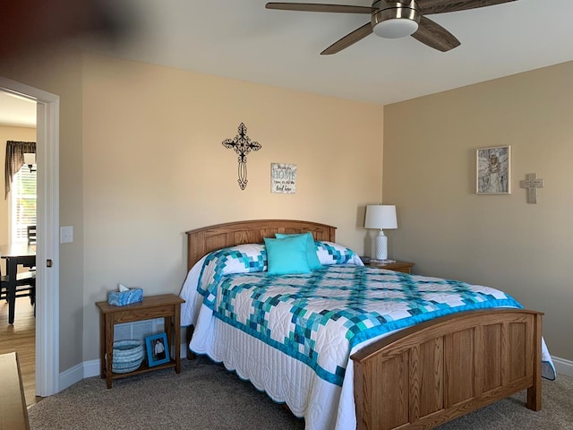 carpeted bedroom featuring ceiling fan