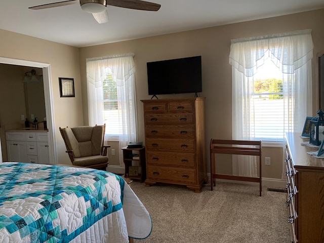 bedroom with ceiling fan and light colored carpet