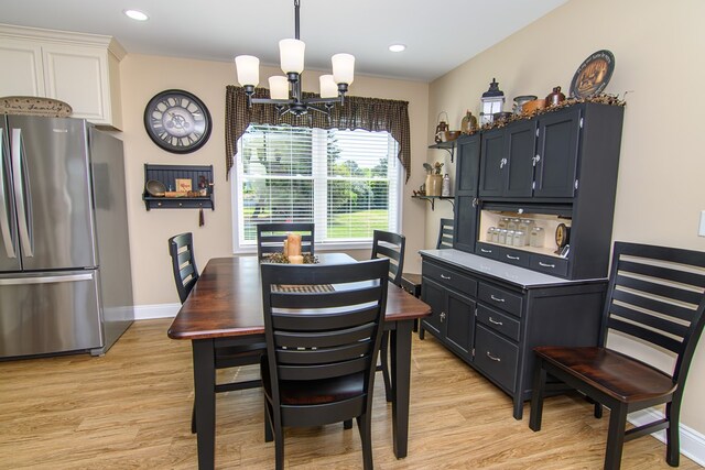 2265 Yardarm Dr, Greenbackville, VA 23356 - dining space with an inviting chandelier, baseboards, recessed lighting, and light wood-style flooring