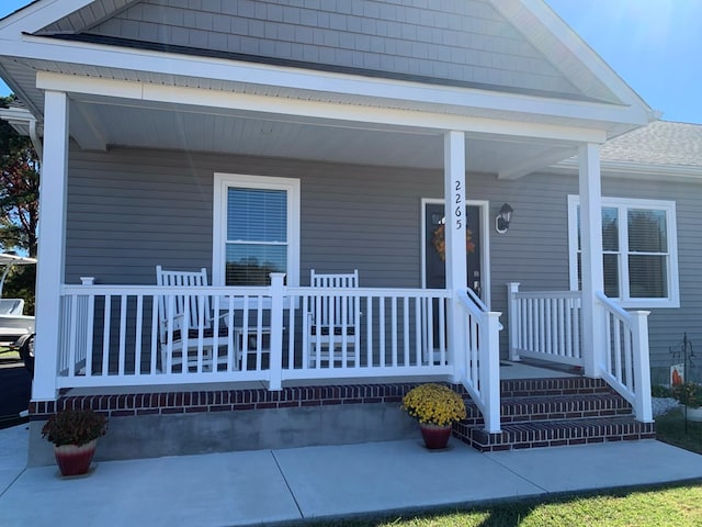 doorway to property featuring a porch