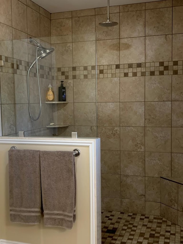 bathroom with a tile shower