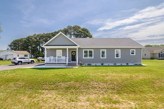 2265 Yardarm Dr, Greenbackville, VA 23356 - single story home featuring roof with shingles, a porch, and a front yard