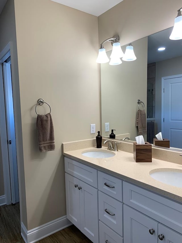 bathroom featuring hardwood / wood-style floors and vanity