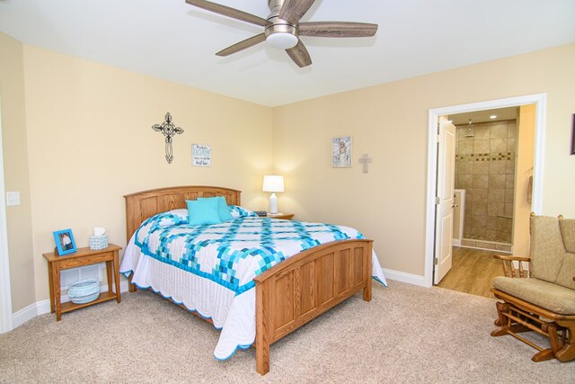 2265 Yardarm Dr, Greenbackville, VA 23356 - bedroom featuring connected bathroom, baseboards, light carpet, and ceiling fan