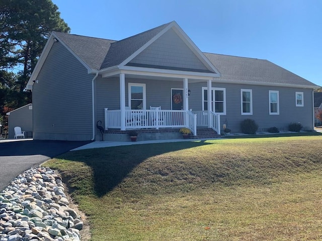 view of front facade with a porch and a front yard