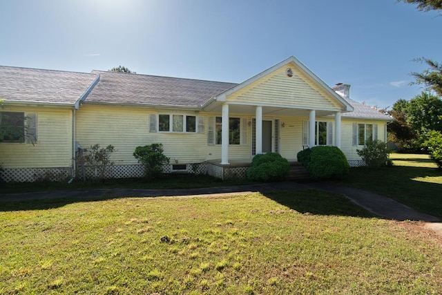 24324 Adams Hill Dr, Accomac, VA 23301 - view of front of house featuring covered porch, a front yard, a chimney, and a shingled roof