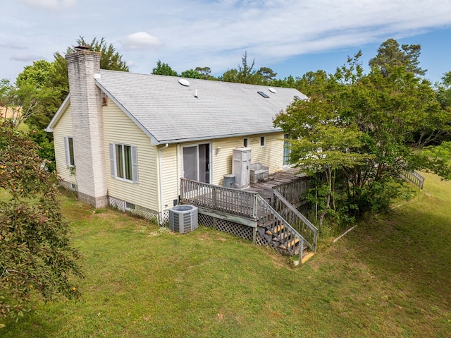 24324 Adams Hill Dr, Accomac, VA 23301 - rear view of house featuring cooling unit, a chimney, a wooden deck, and a lawn