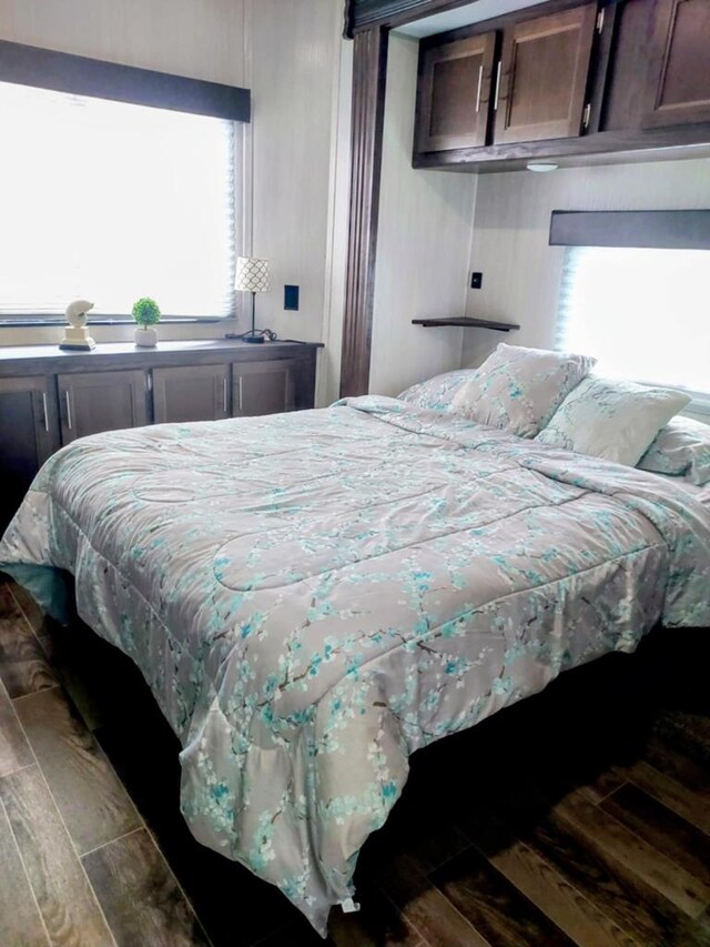 bedroom featuring dark hardwood / wood-style flooring