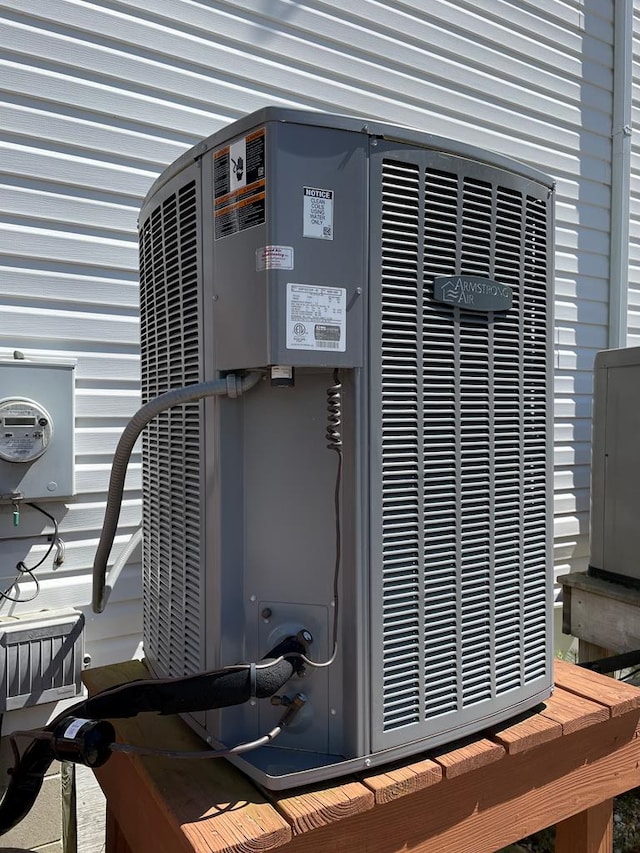 4097 Grand Bay Ct, Chincoteague, VA 23336 - exterior view of central air condition unit and electric meter