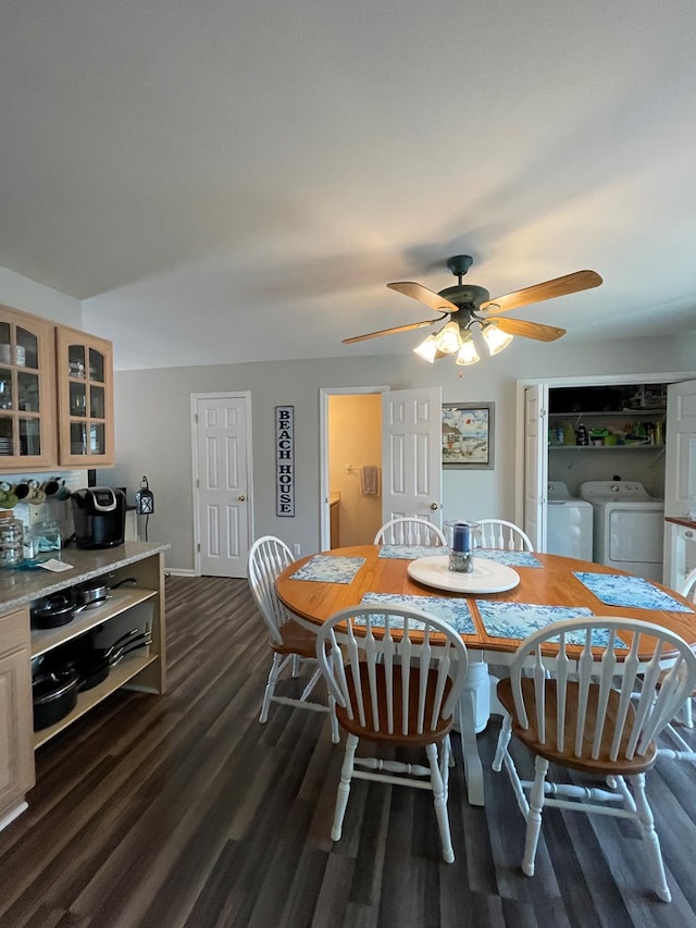 4097 Grand Bay Ct, Chincoteague, VA 23336 - dining room with separate washer and dryer, dark wood finished floors, a ceiling fan, and baseboards