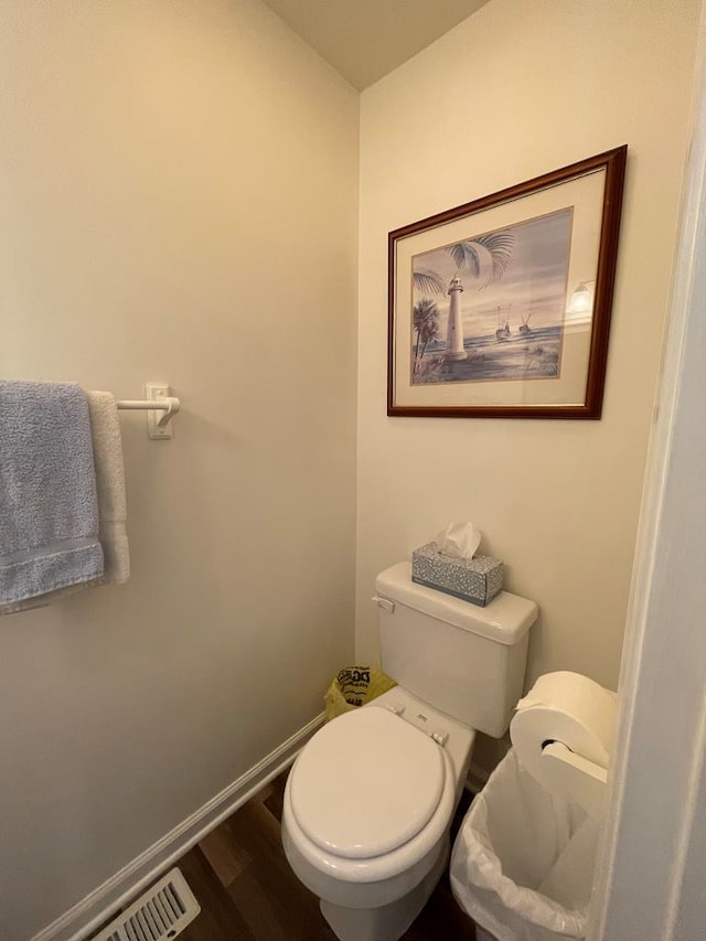 4097 Grand Bay Ct, Chincoteague, VA 23336 - bathroom with toilet and wood finished floors