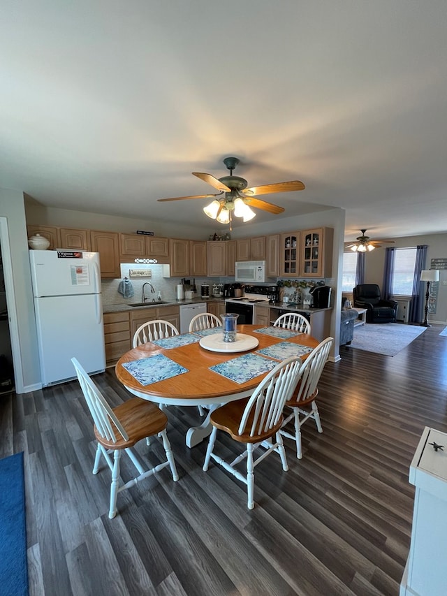 4097 Grand Bay Ct, Chincoteague, VA 23336 - dining area with a ceiling fan and dark wood-style flooring