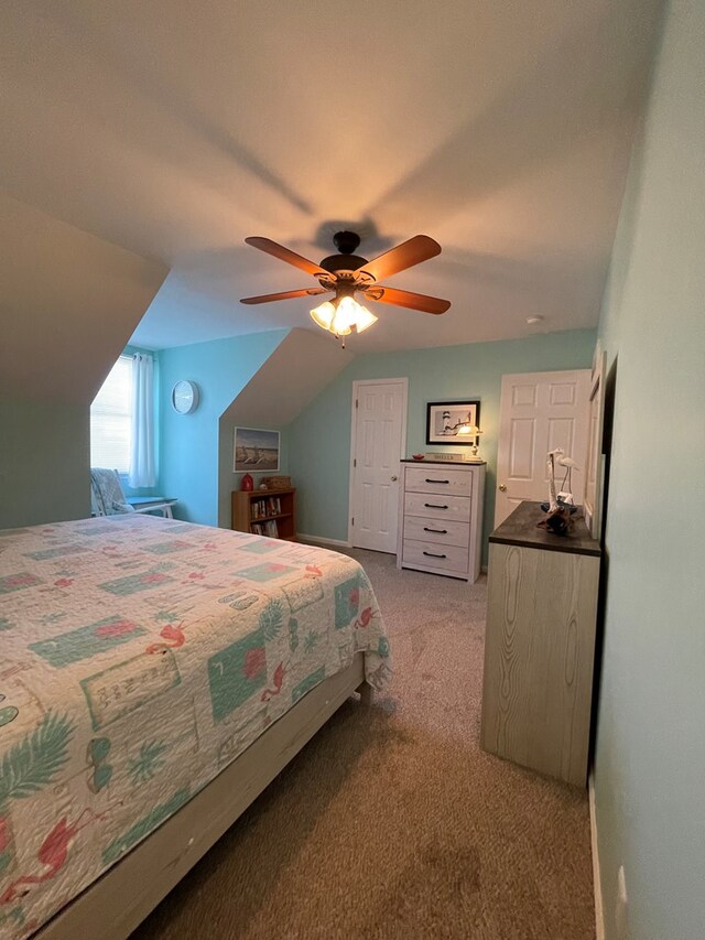 4097 Grand Bay Ct, Chincoteague, VA 23336 - bedroom featuring light colored carpet, a ceiling fan, and lofted ceiling