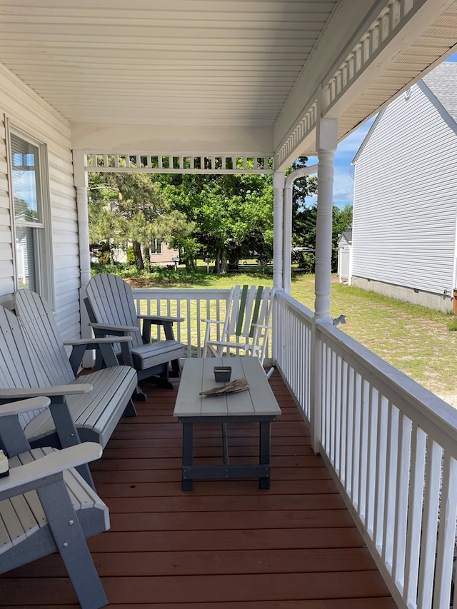 4097 Grand Bay Ct, Chincoteague, VA 23336 - wooden terrace with a lawn and covered porch