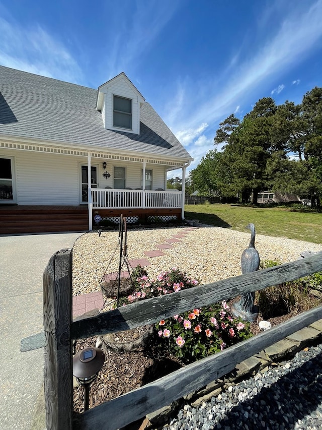 4097 Grand Bay Ct, Chincoteague, VA 23336 - view of front of house featuring roof with shingles and covered porch
