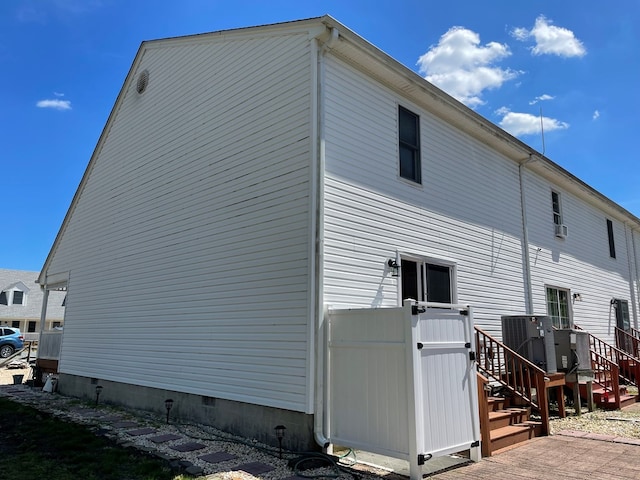 4097 Grand Bay Ct, Chincoteague, VA 23336 - view of property exterior featuring central AC and crawl space