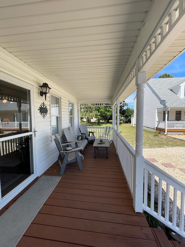 4097 Grand Bay Ct, Chincoteague, VA 23336 - wooden deck featuring covered porch