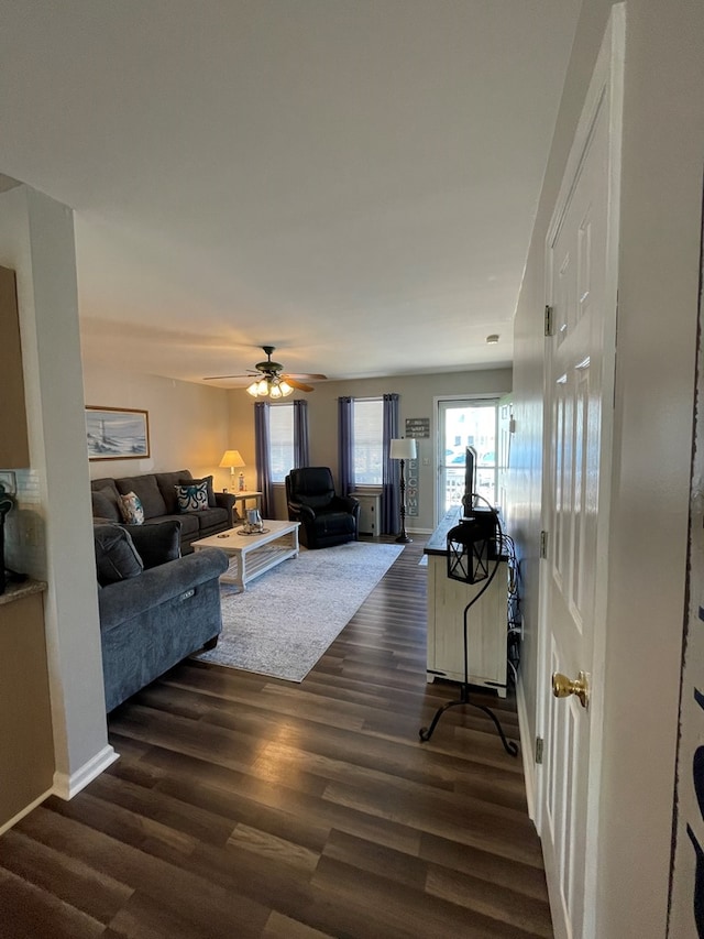 4097 Grand Bay Ct, Chincoteague, VA 23336 - living room featuring dark wood-style flooring, a ceiling fan, and baseboards