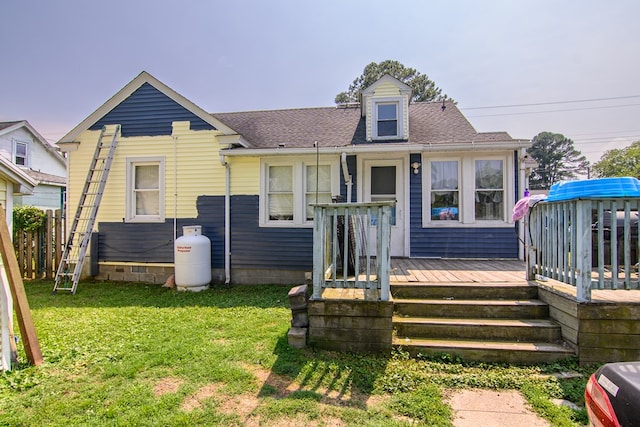 19499 Main St, Melfa, VA 23410 - view of front of home featuring a front yard, a shingled roof, and a wooden deck