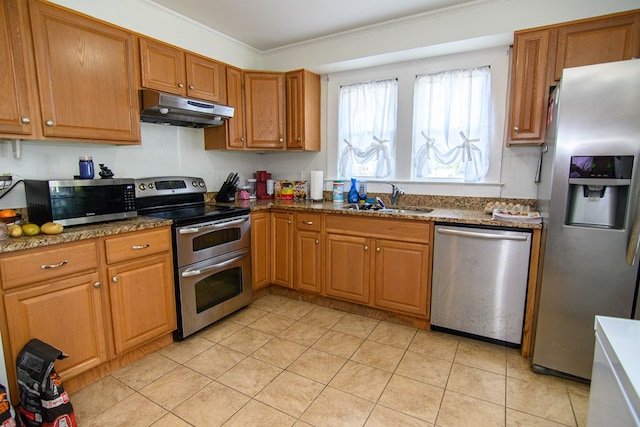 19499 Main St, Melfa, VA 23410 - kitchen with stainless steel appliances, under cabinet range hood, crown molding, brown cabinets, and light tile patterned floors