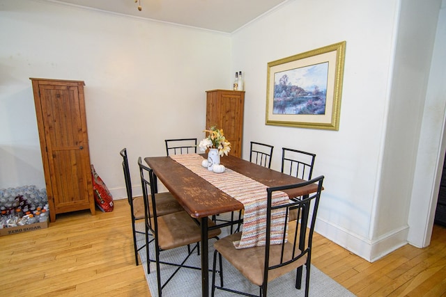 19499 Main St, Melfa, VA 23410 - dining room featuring light wood-type flooring and crown molding