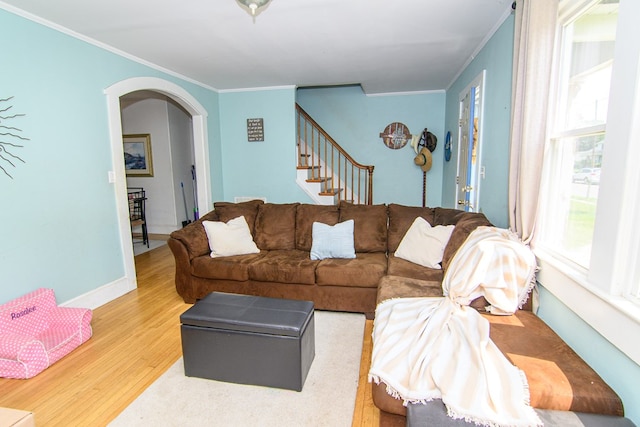 19499 Main St, Melfa, VA 23410 - living area with ornamental molding, light wood-type flooring, arched walkways, and stairs