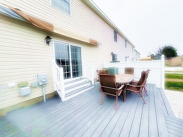 wooden deck with outdoor dining space