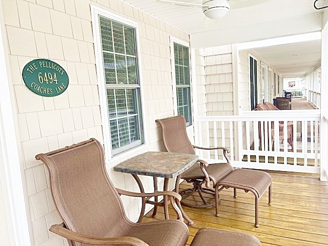 exterior space with covered porch and ceiling fan