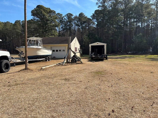 view of yard featuring a garage