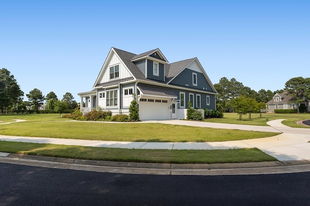 2 Moon Ct, Cape Charles, VA 23310 - view of front of house featuring concrete driveway, a front yard, a standing seam roof, and a garage