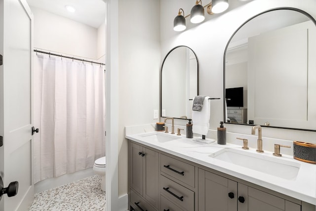 2 Moon Ct, Cape Charles, VA 23310 - bathroom featuring double vanity, toilet, and shower / bath combo