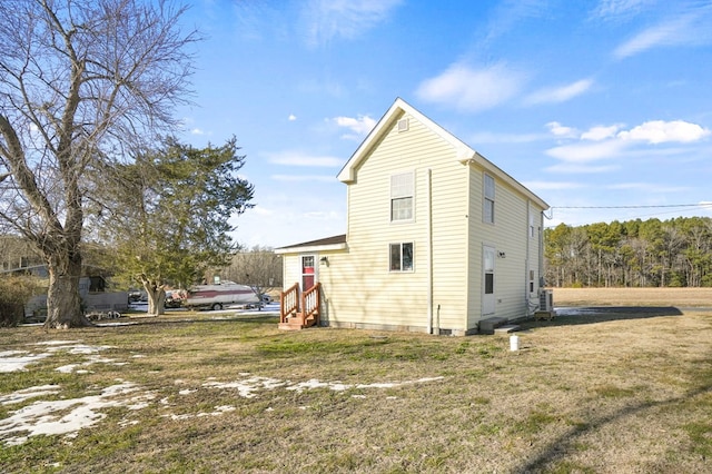 view of property exterior with a lawn