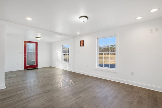 empty room with dark hardwood / wood-style floors