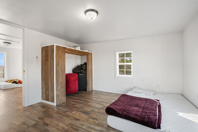 bedroom featuring dark hardwood / wood-style flooring