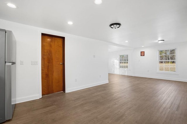 empty room featuring dark wood-type flooring