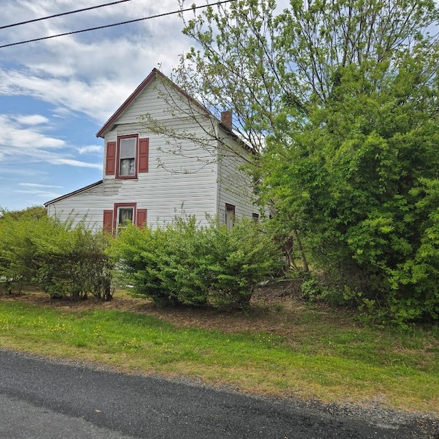 22170 Raymond Ln, Cape Charles, VA 23310 - view of property exterior with a chimney
