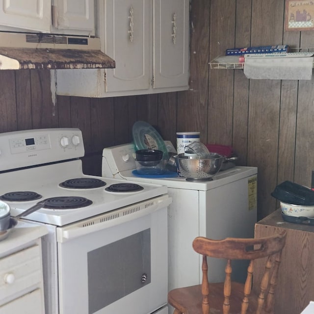 22170 Raymond Ln, Cape Charles, VA 23310 - kitchen featuring washer / dryer, white electric stove, wooden walls, and extractor fan