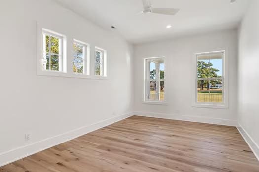 empty room with light hardwood / wood-style floors and ceiling fan