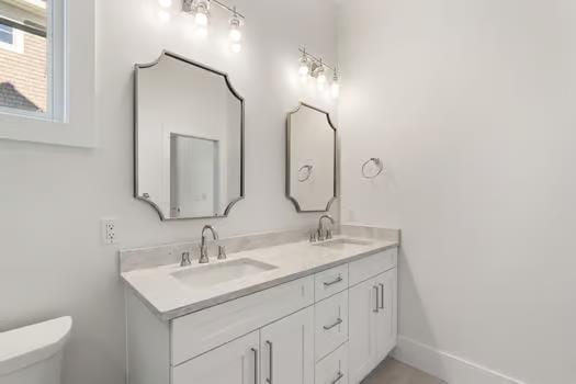 bathroom with vanity and toilet