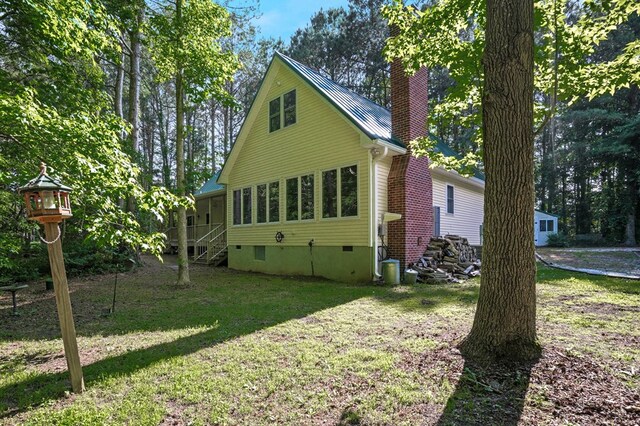 3315 Seaside Rd, Exmore, VA 23350 - back of house featuring a chimney, crawl space, a yard, and metal roof