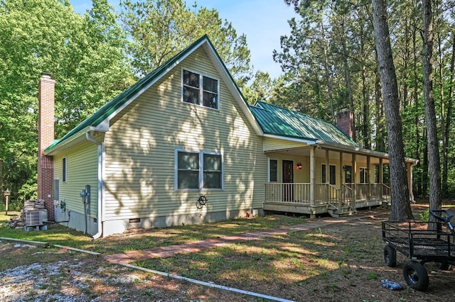 3315 Seaside Rd, Exmore, VA 23350 - back of property featuring a chimney, a porch, crawl space, metal roof, and central AC unit
